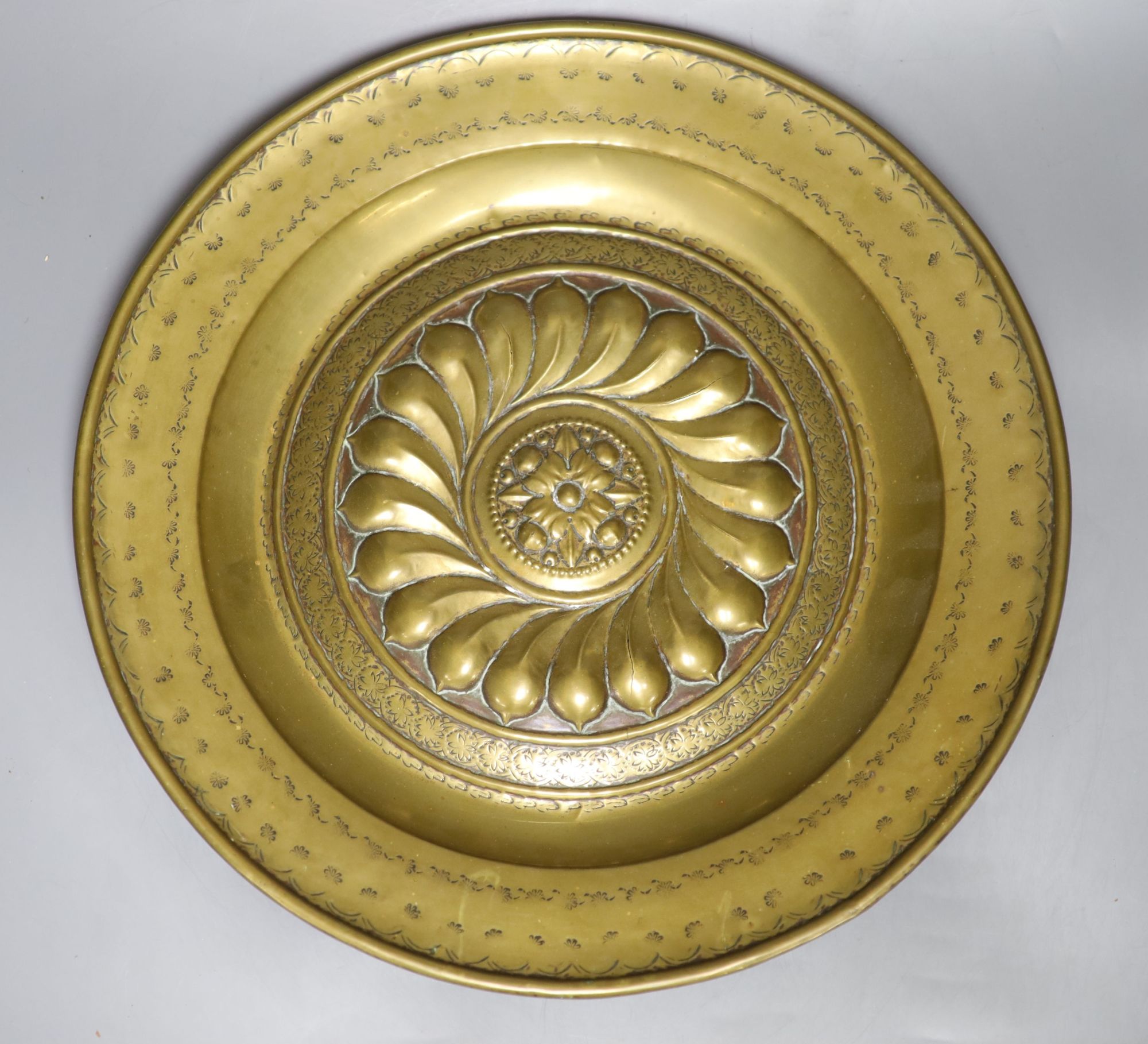 A 17th century Nuremberg brass alms dish, diameter 43cm